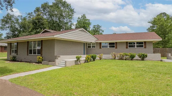 front view of a house with a yard