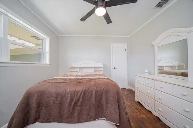 a bedroom with a bed and a dresser