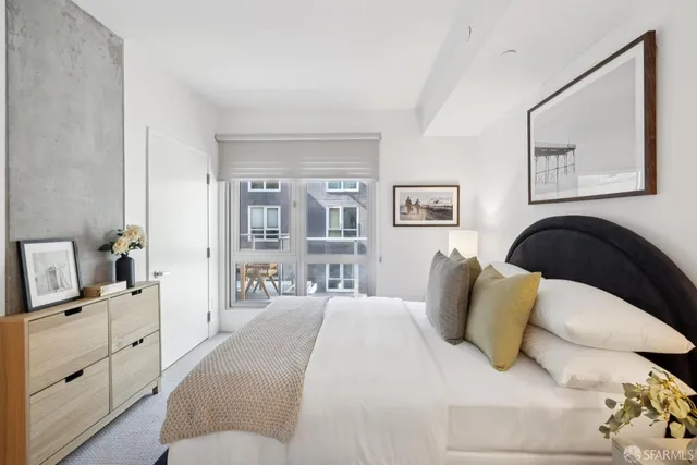 a bedroom with a bed and lamp