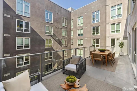 a view of a patio filled with furniture