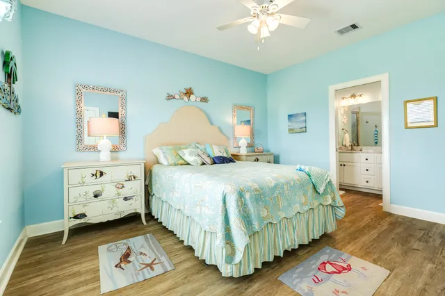 a bathroom with a granite countertop sink a mirror and a shower