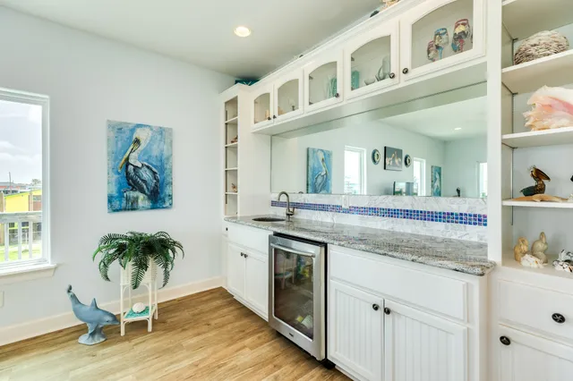 a view of a kitchen cabinets and dining room