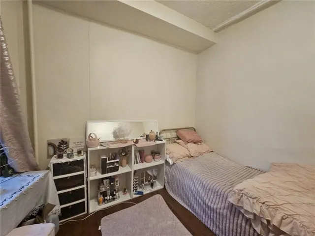 a bedroom with a bed and closet