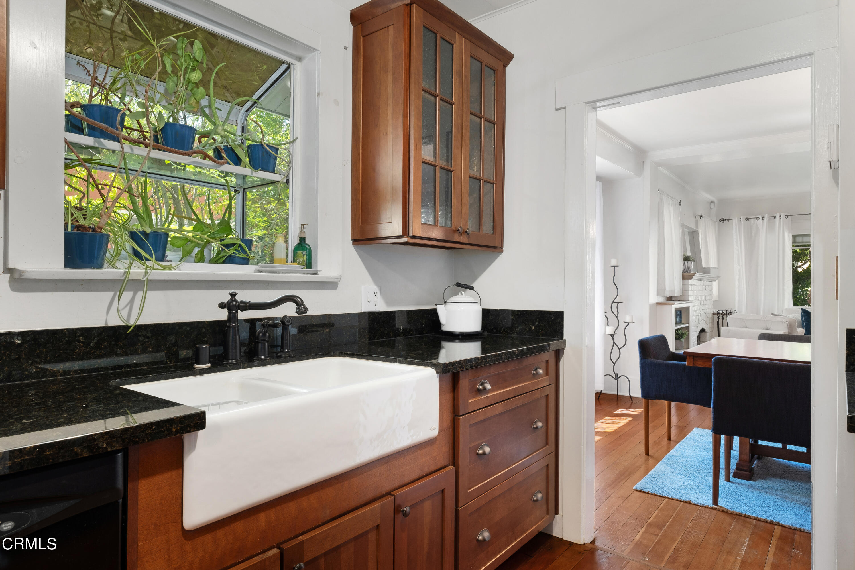 1640 Brigden Road Pasadena, CA 91104 - Photo 14 of 39 a kitchen with a sink a window and cabinets