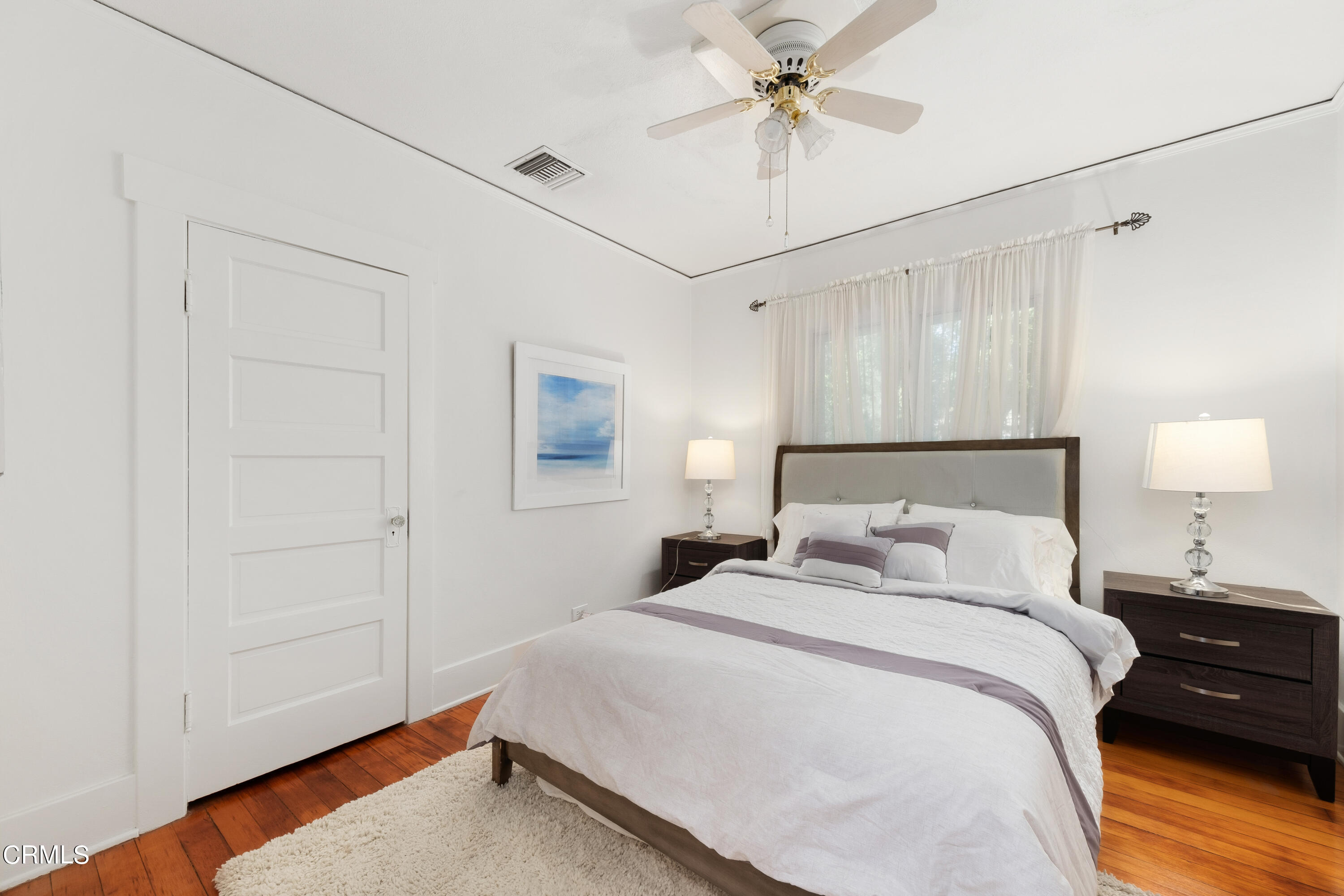 1640 Brigden Road Pasadena, CA 91104 - Photo 18 of 39 a bedroom with a bed and a chandelier