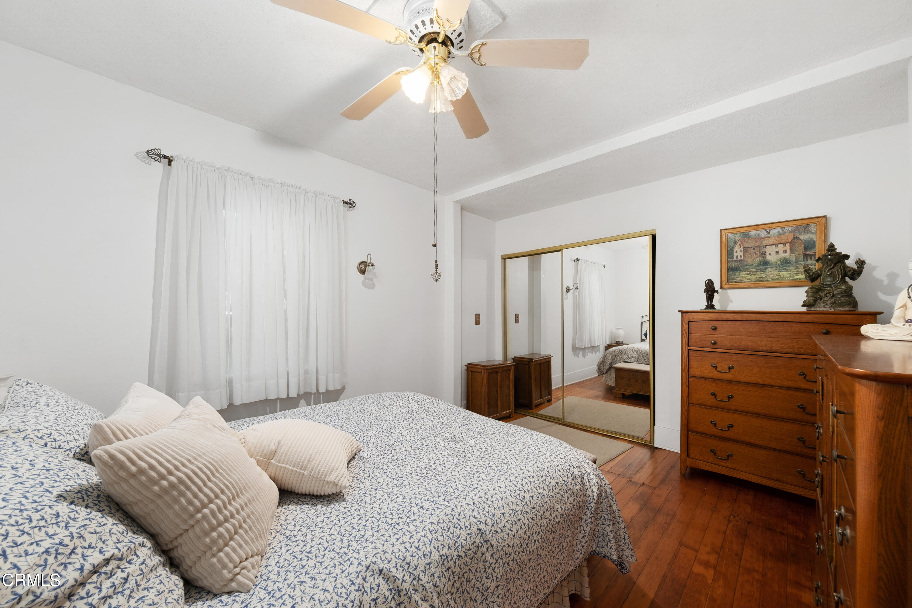 1640 Brigden Road Pasadena, CA 91104 - Photo 19 of 39 a bedroom with a bed and a chandelier