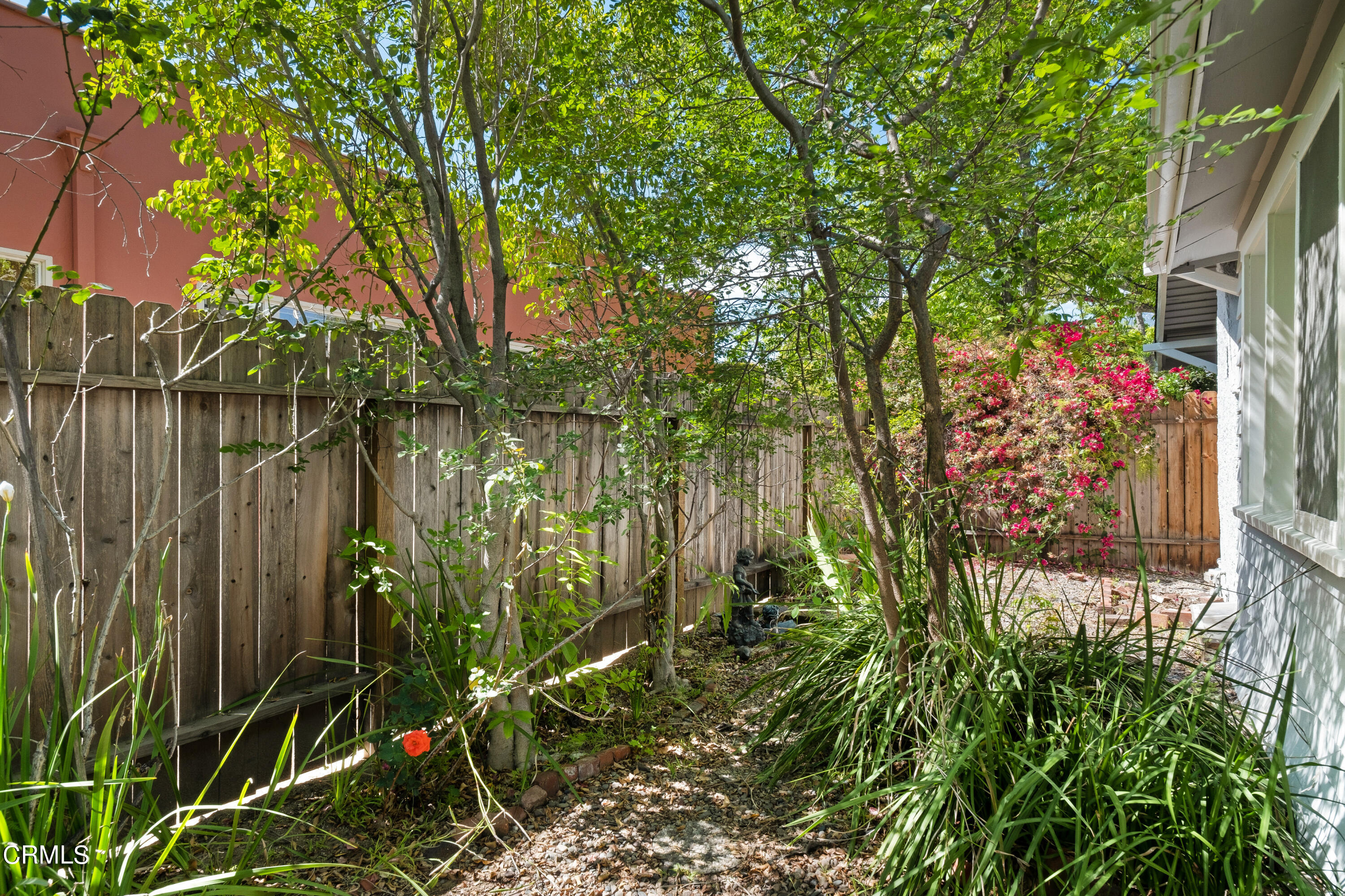 1640 Brigden Road Pasadena, CA 91104 - Photo 21 of 39 a backyard of a house with lots of green space and a lake view