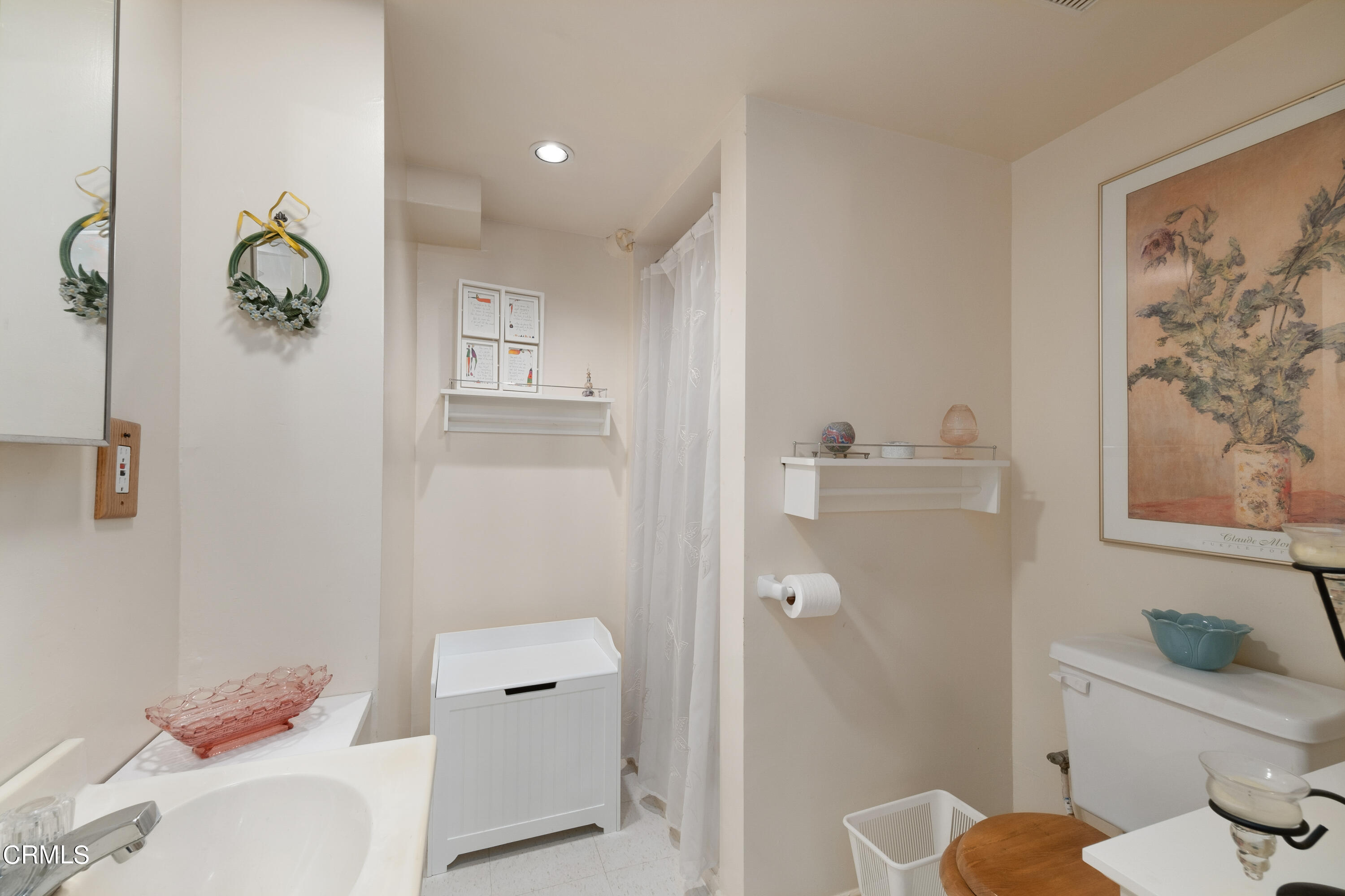 1640 Brigden Road Pasadena, CA 91104 - Photo 34 of 39 a bathroom with a toilet and a shower curtain