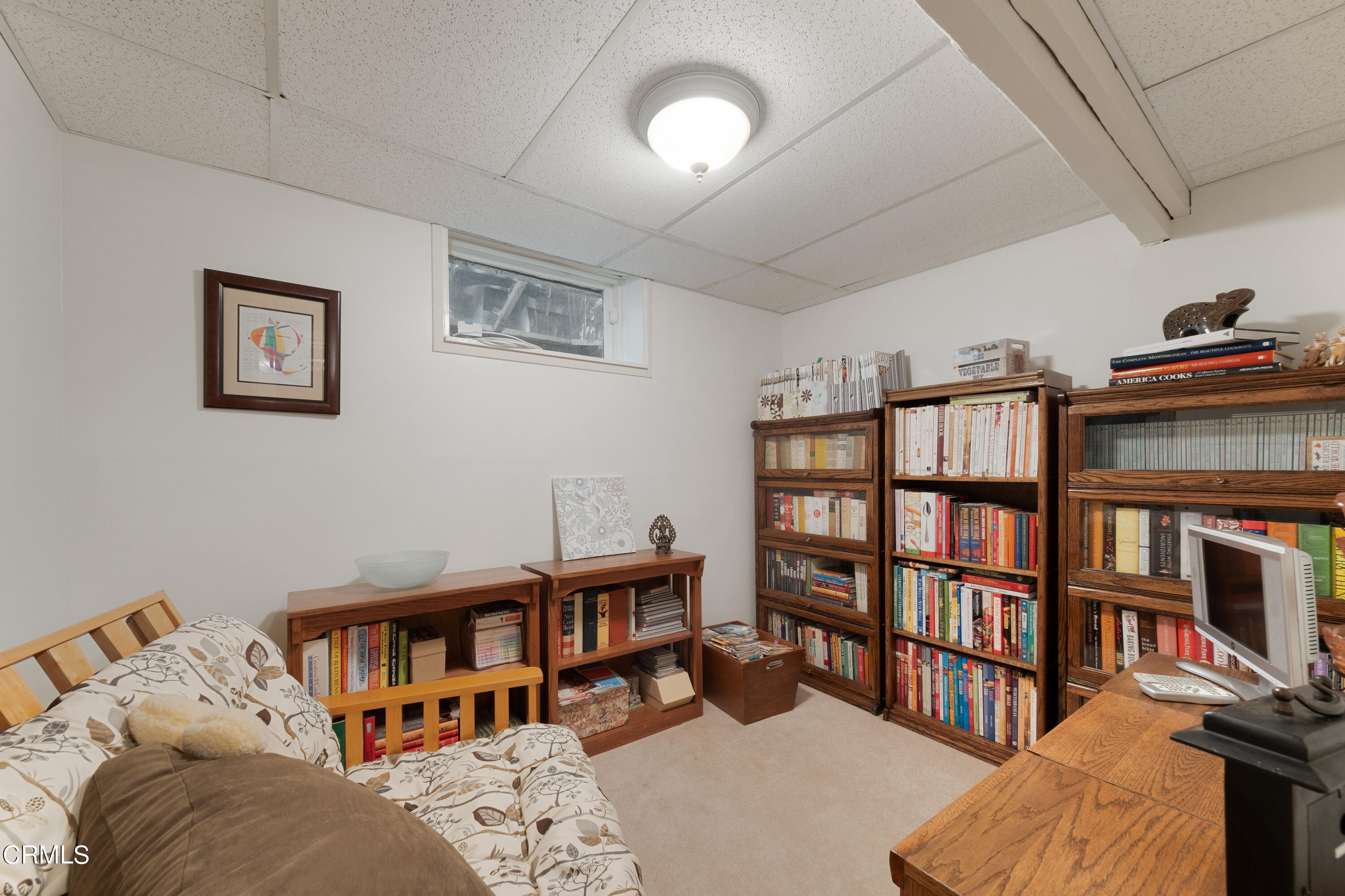 1640 Brigden Road Pasadena, CA 91104 - Photo 37 of 39 a bedroom with furniture and a book shelf