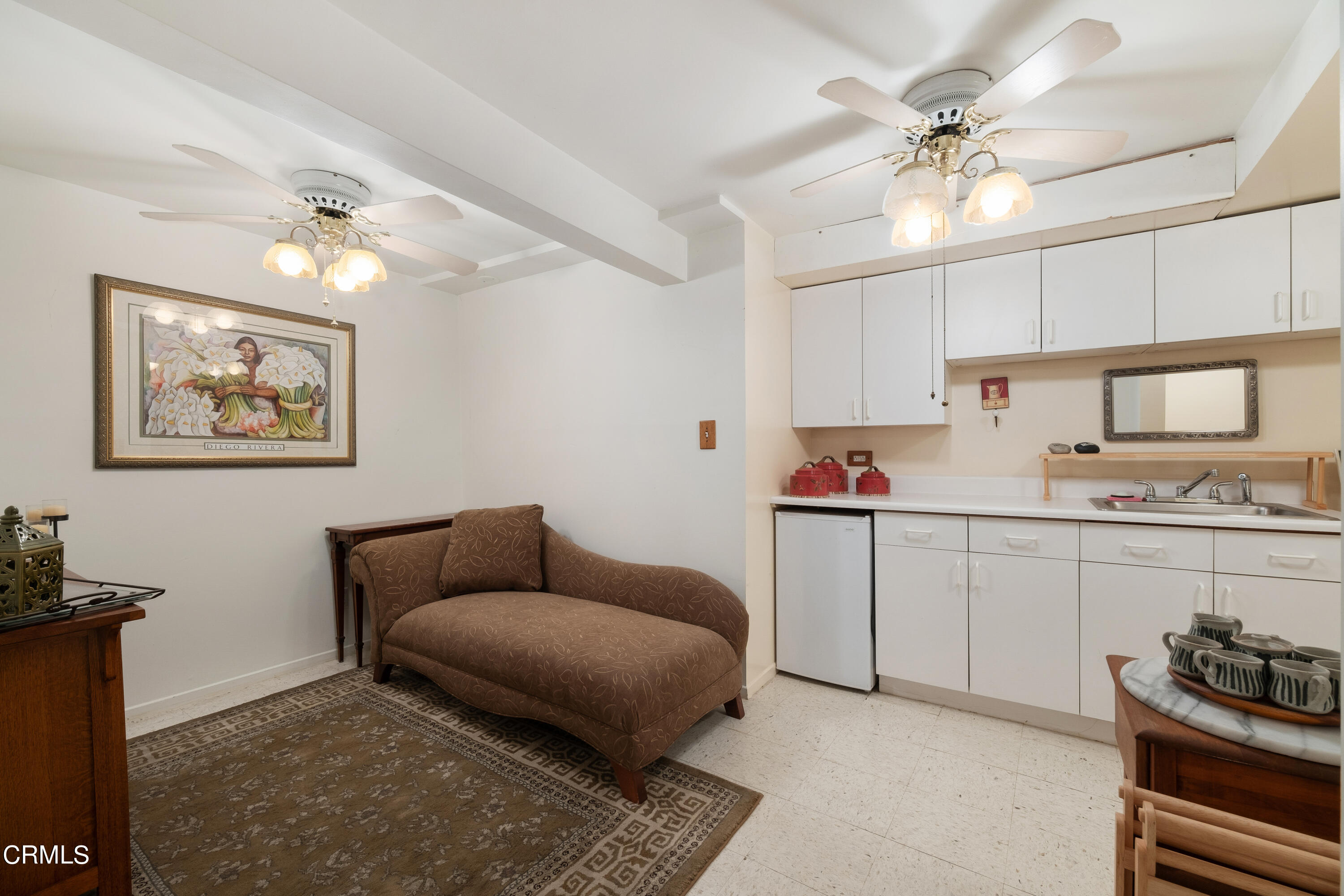 1640 Brigden Road Pasadena, CA 91104 - Photo 38 of 39 a living room with kitchen island furniture and a chandelier