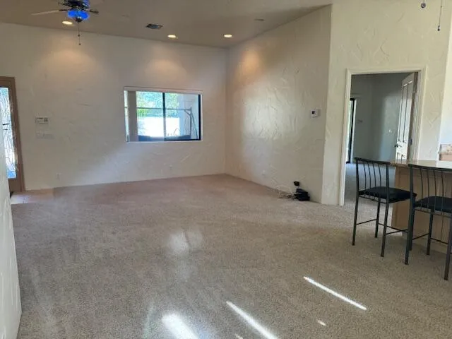 a view of a livingroom with furniture and windows