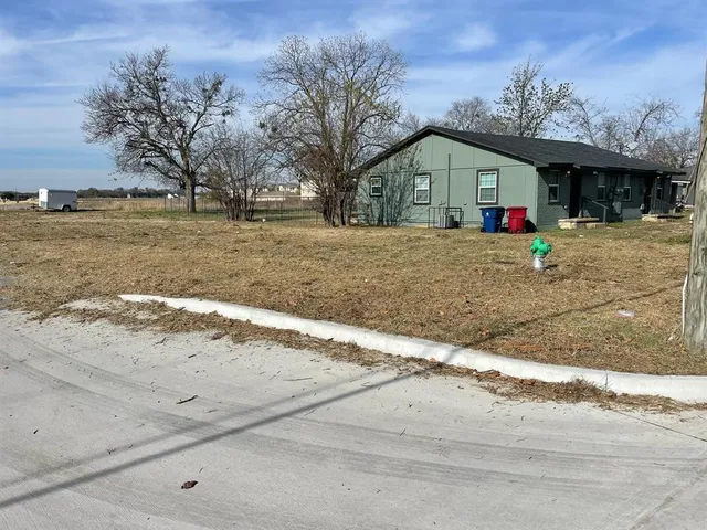 a view of a house with a snow on the road