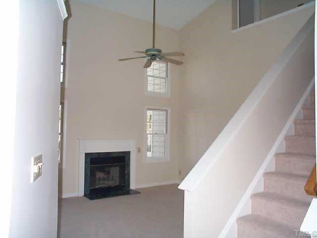 Living room with fireplace and vaulted ceiling. Other