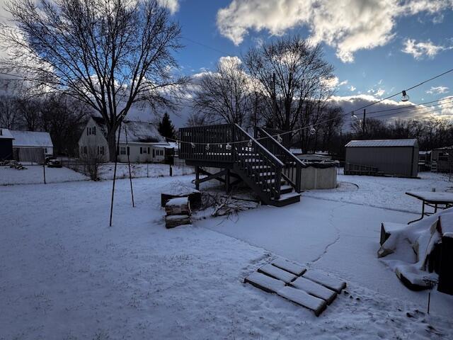 411 Prescott Road Valparaiso, IN 46385 - Photo 13 of 14 a view of a patio with a table and chairs with a fire pit and a tree