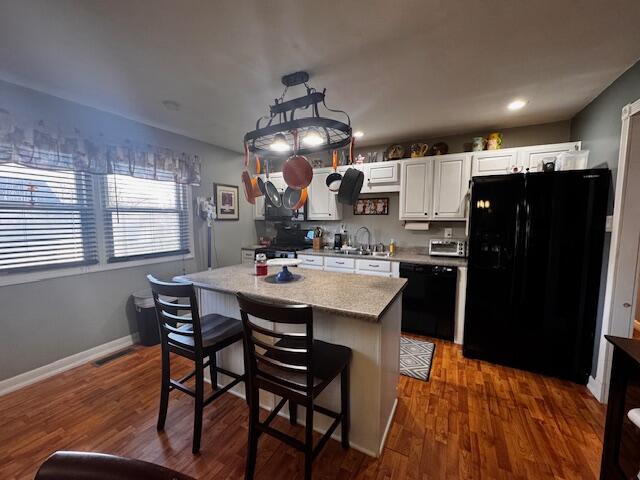 411 Prescott Road Valparaiso, IN 46385 - Photo 4 of 14 a kitchen with stainless steel appliances a dining table chairs and chandelier
