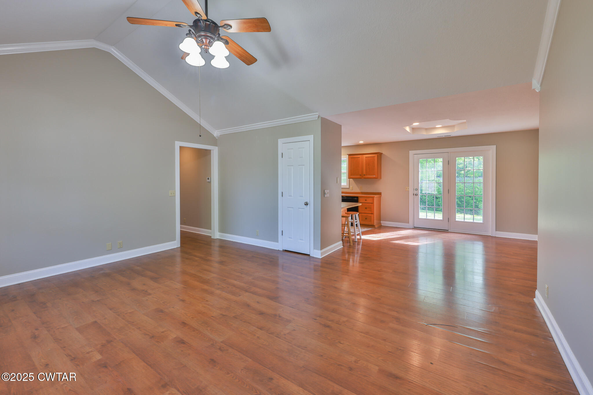 679 North Main Street Dyer, TN 38330 - Photo 11 of 25 a view of empty room with wooden floor and fan