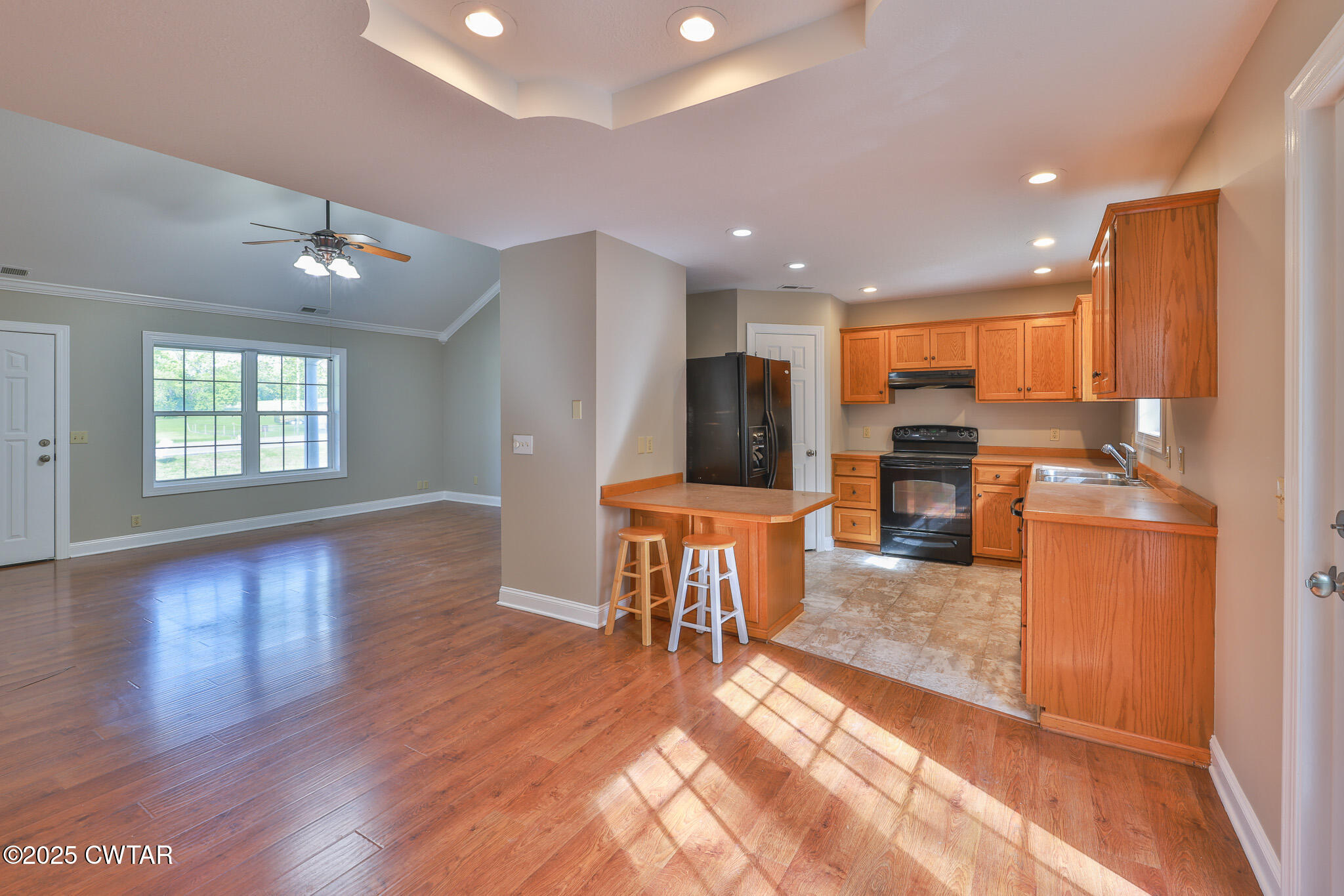 679 North Main Street Dyer, TN 38330 - Photo 13 of 25 a view of kitchen with stainless steel appliances granite countertop a stove top oven a dining table and chairs with wooden floor
