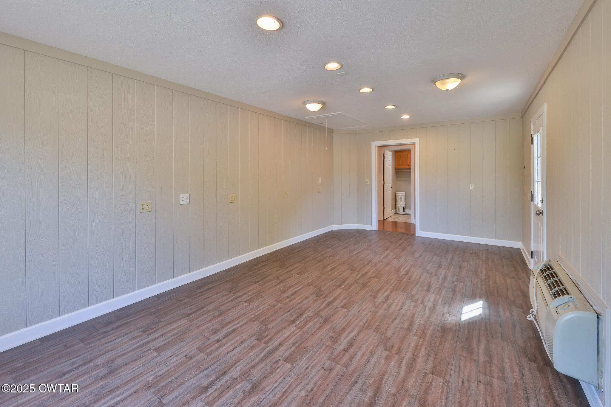 679 North Main Street Dyer, TN 38330 - Photo 17 of 25 a view of empty room with wooden floor
