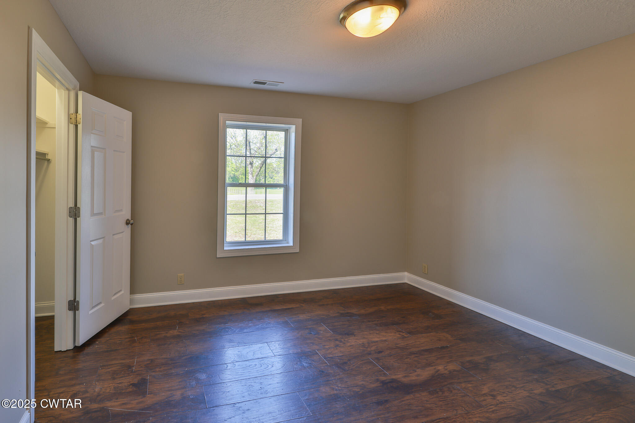 679 North Main Street Dyer, TN 38330 - Photo 20 of 25 a view of a livingroom with wooden floor and window
