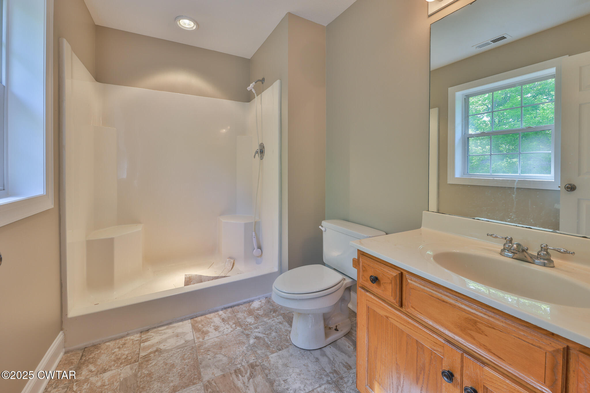 679 North Main Street Dyer, TN 38330 - Photo 24 of 25 a bathroom with a sink toilet and shower