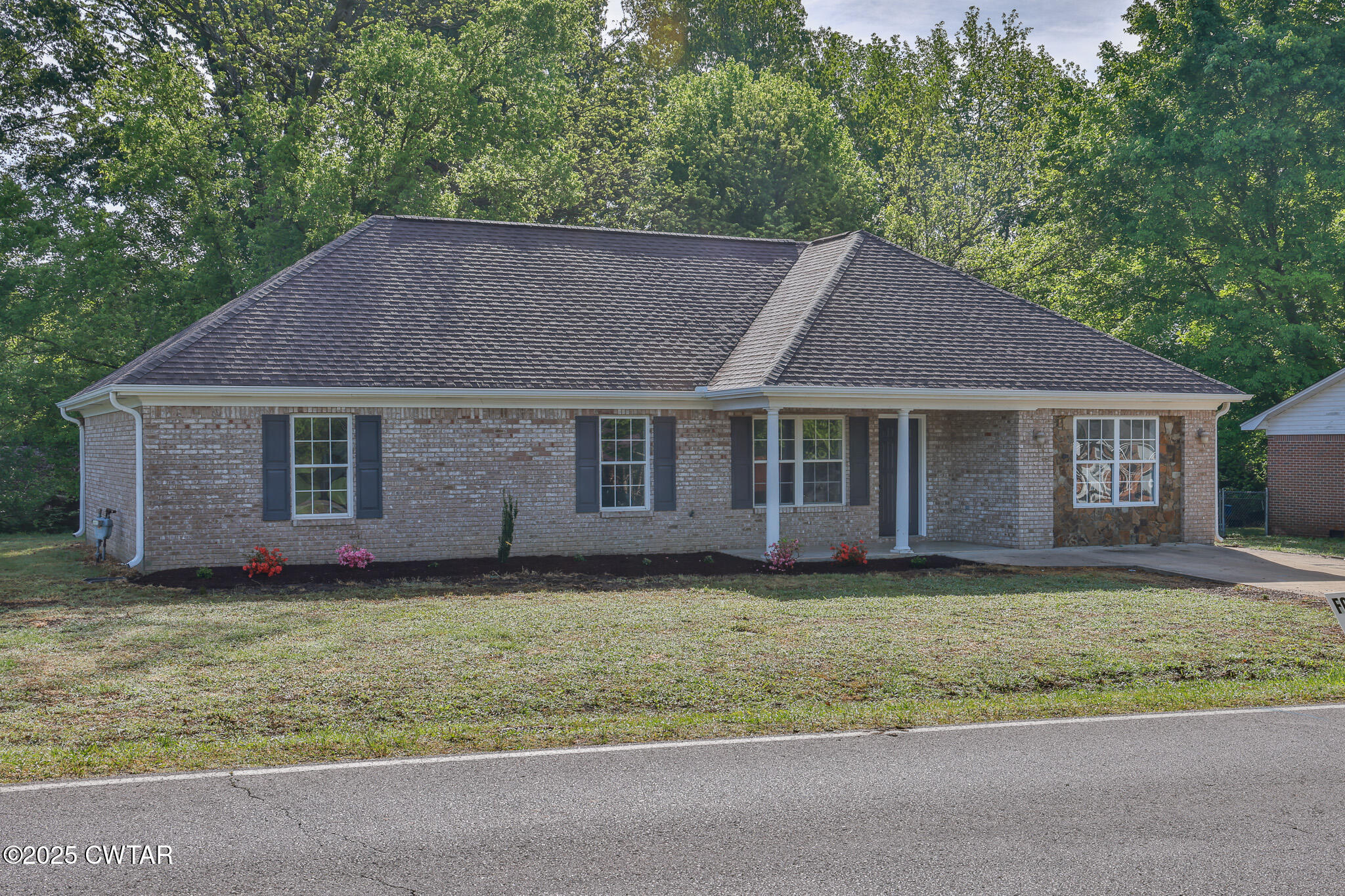 679 North Main Street Dyer, TN 38330 - Photo 4 of 25 a house that has a big yard in front of it