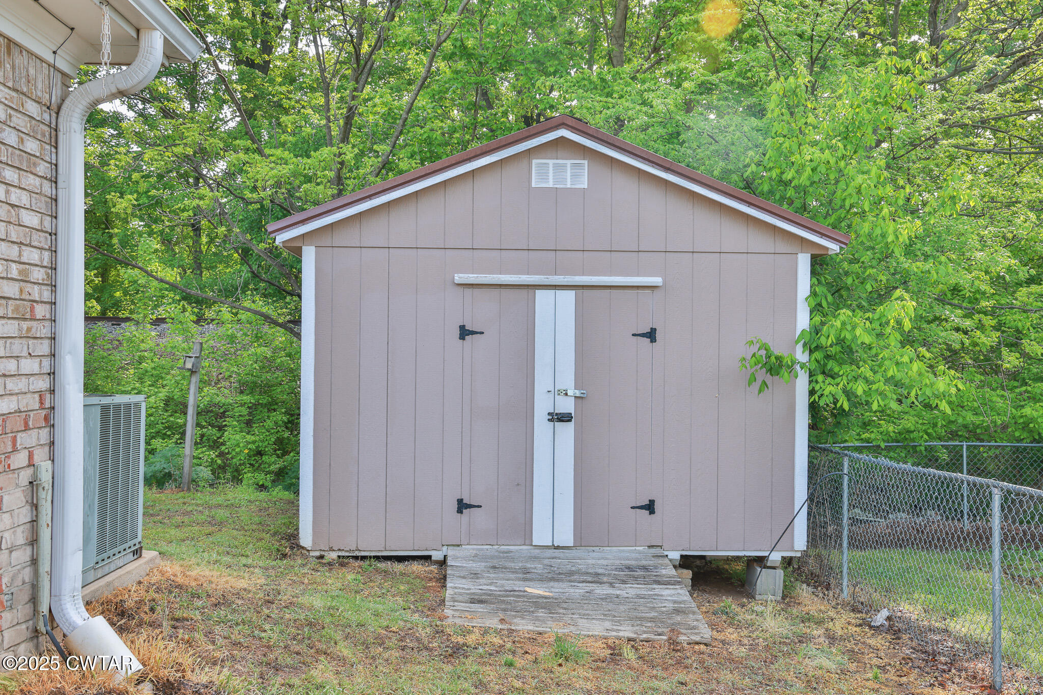 679 North Main Street Dyer, TN 38330 - Photo 6 of 25 a view of a house with backyard