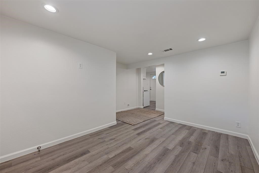 901 Valdez Street, Unit A Austin, TX 78741 - Photo 14 of 16 Living room featuring recessed lighting and wood-look vinyl flooring