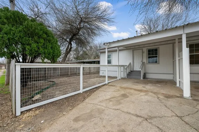 a view of backyard with cabin