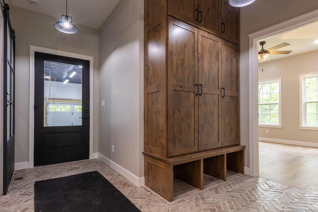 21650 Lake Road Glouster, OH 45732 - Photo 42 of 77 Mudroom with custom brick flooring