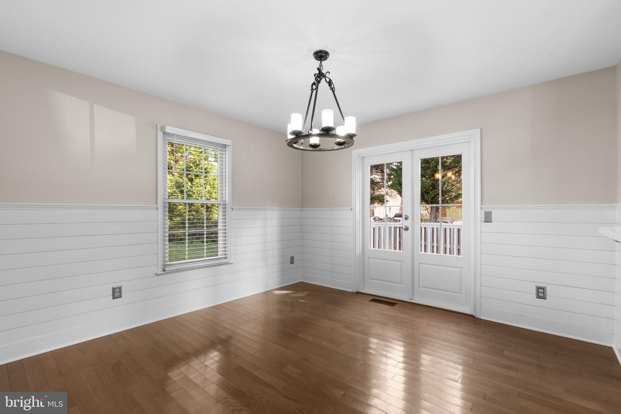 1000 Windrush Lane, Unit 18 Sandy Spring, MD 20860 - Photo 8 of 35 a view of a livingroom with wooden floor and windows