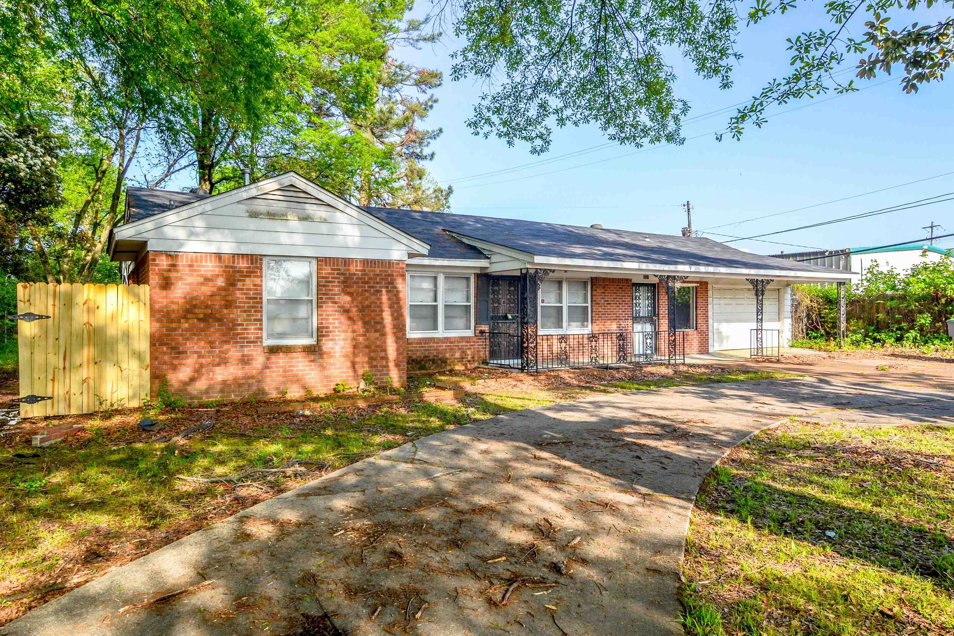5227 Millbranch Road Memphis, TN 38116 - Photo 3 of 19 a front view of a house with a yard