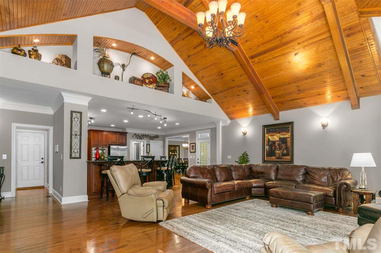 8005 Kukui Court Raleigh, NC 27613 - Photo 2 of 30 a living room with furniture and a wooden floor