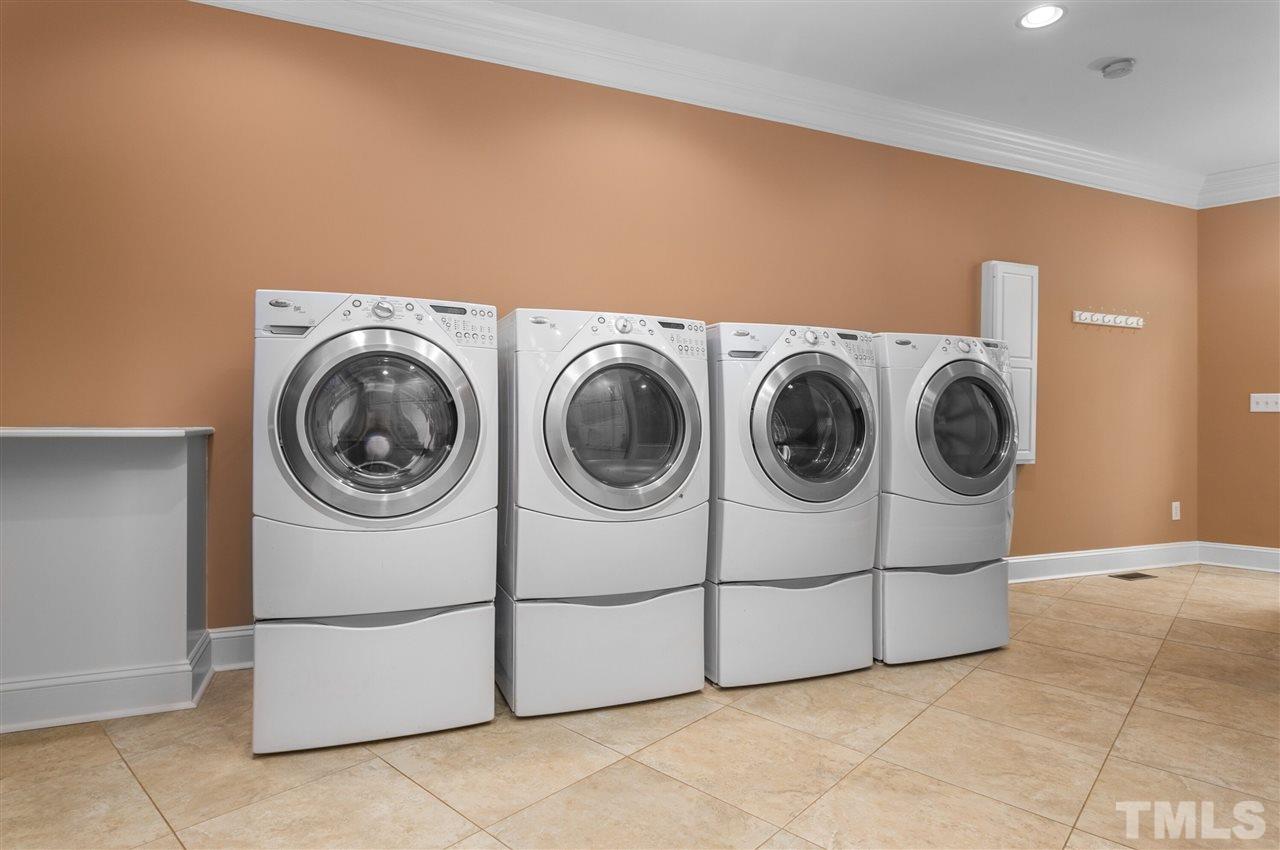 8005 Kukui Court Raleigh, NC 27613 - Photo 13 of 30 a utility room with dryer and washer