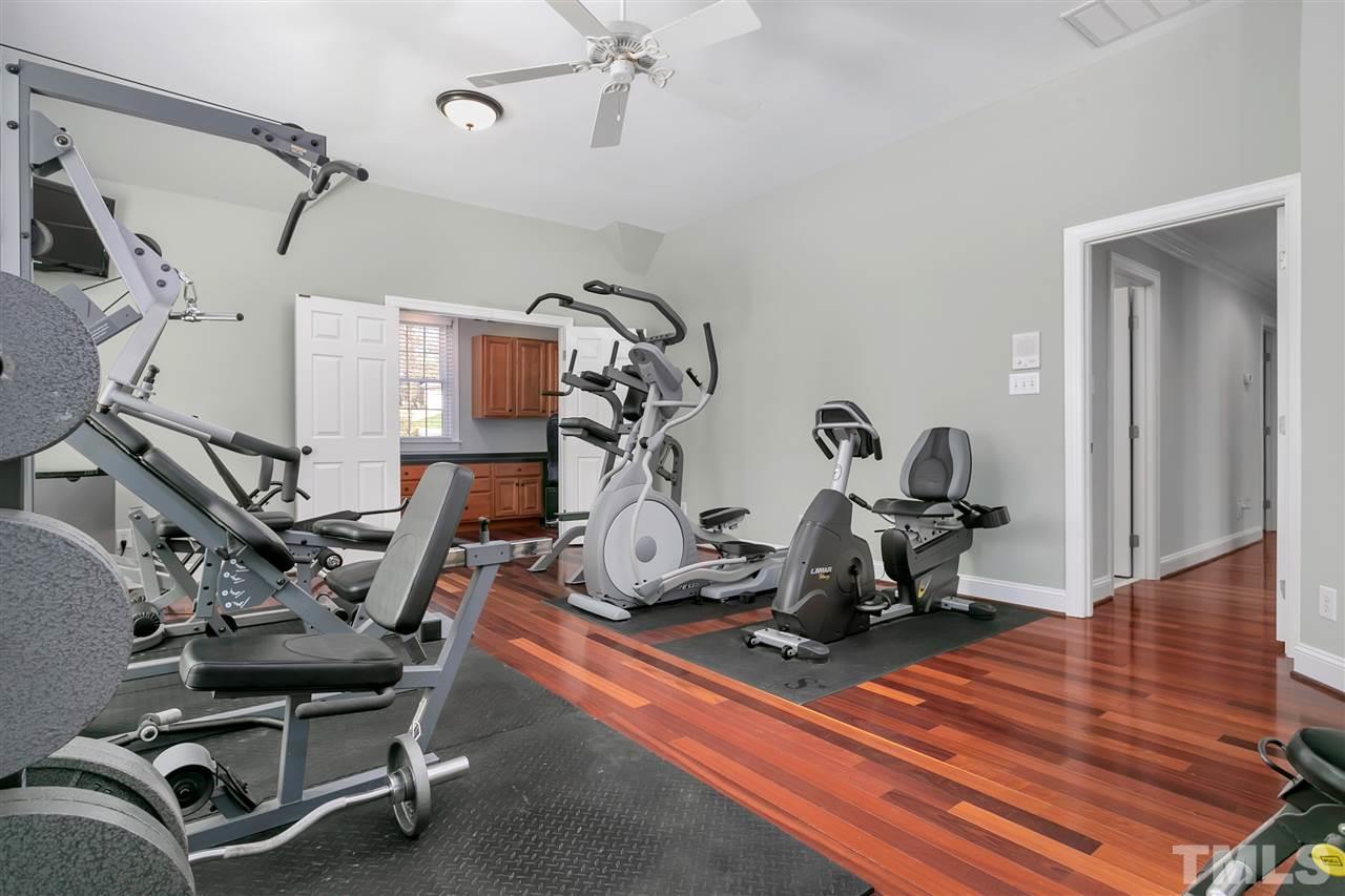 8005 Kukui Court Raleigh, NC 27613 - Photo 18 of 30 a view of a room with gym equipment