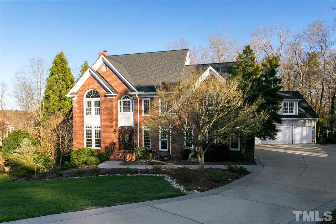8005 Kukui Court Raleigh, NC 27613 - Photo 3 of 30 a front view of a house with a yard