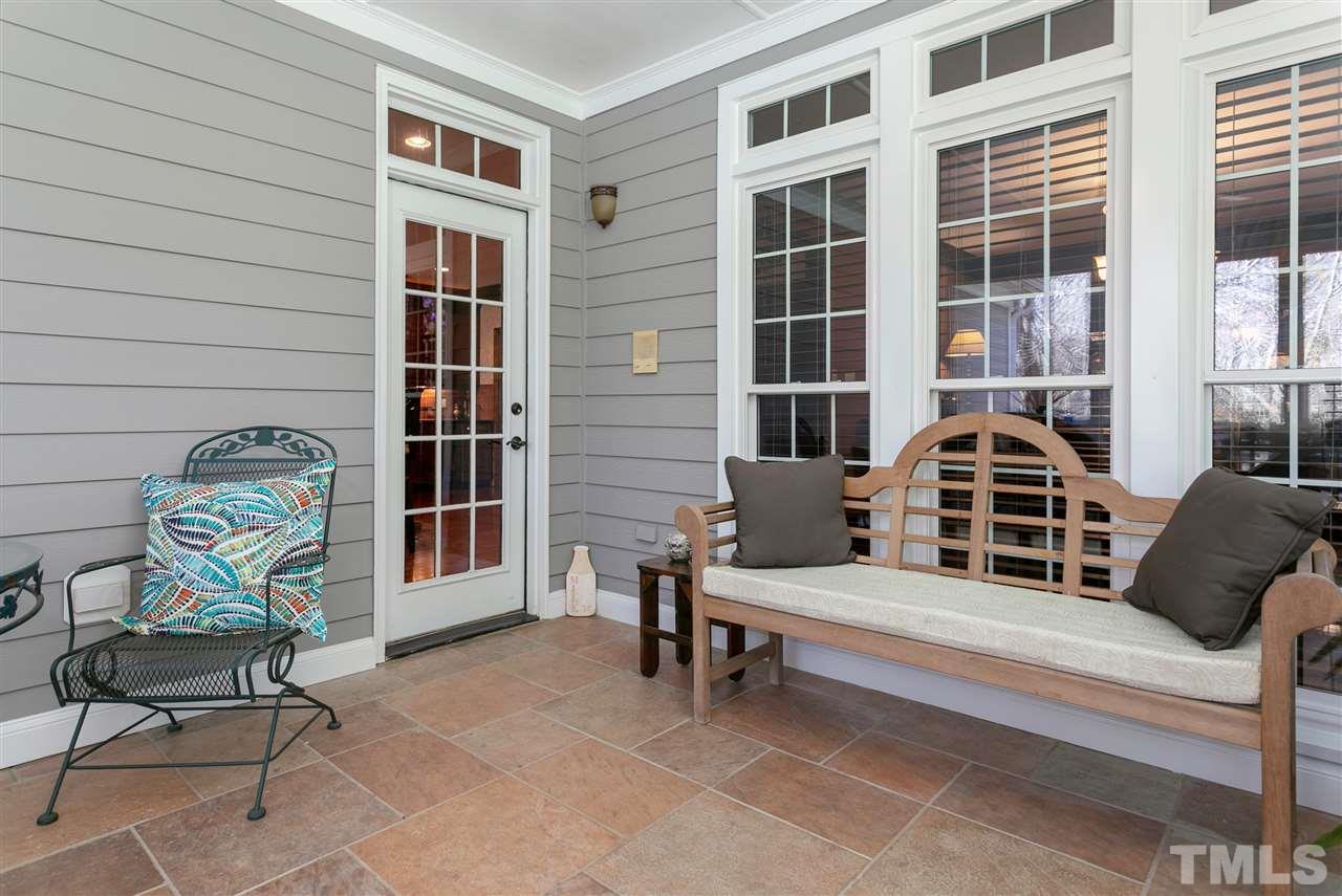 8005 Kukui Court Raleigh, NC 27613 - Photo 22 of 30 a bench sitting in front of a building