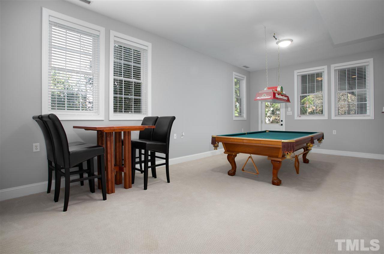 8005 Kukui Court Raleigh, NC 27613 - Photo 23 of 30 a room with furniture a table and windows