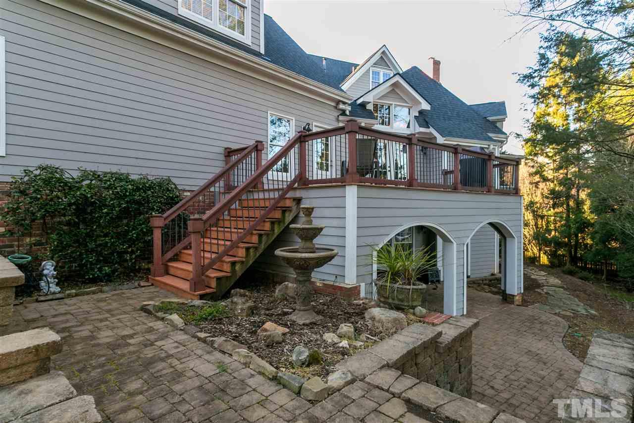 8005 Kukui Court Raleigh, NC 27613 - Photo 27 of 30 a front view of a house with a yard