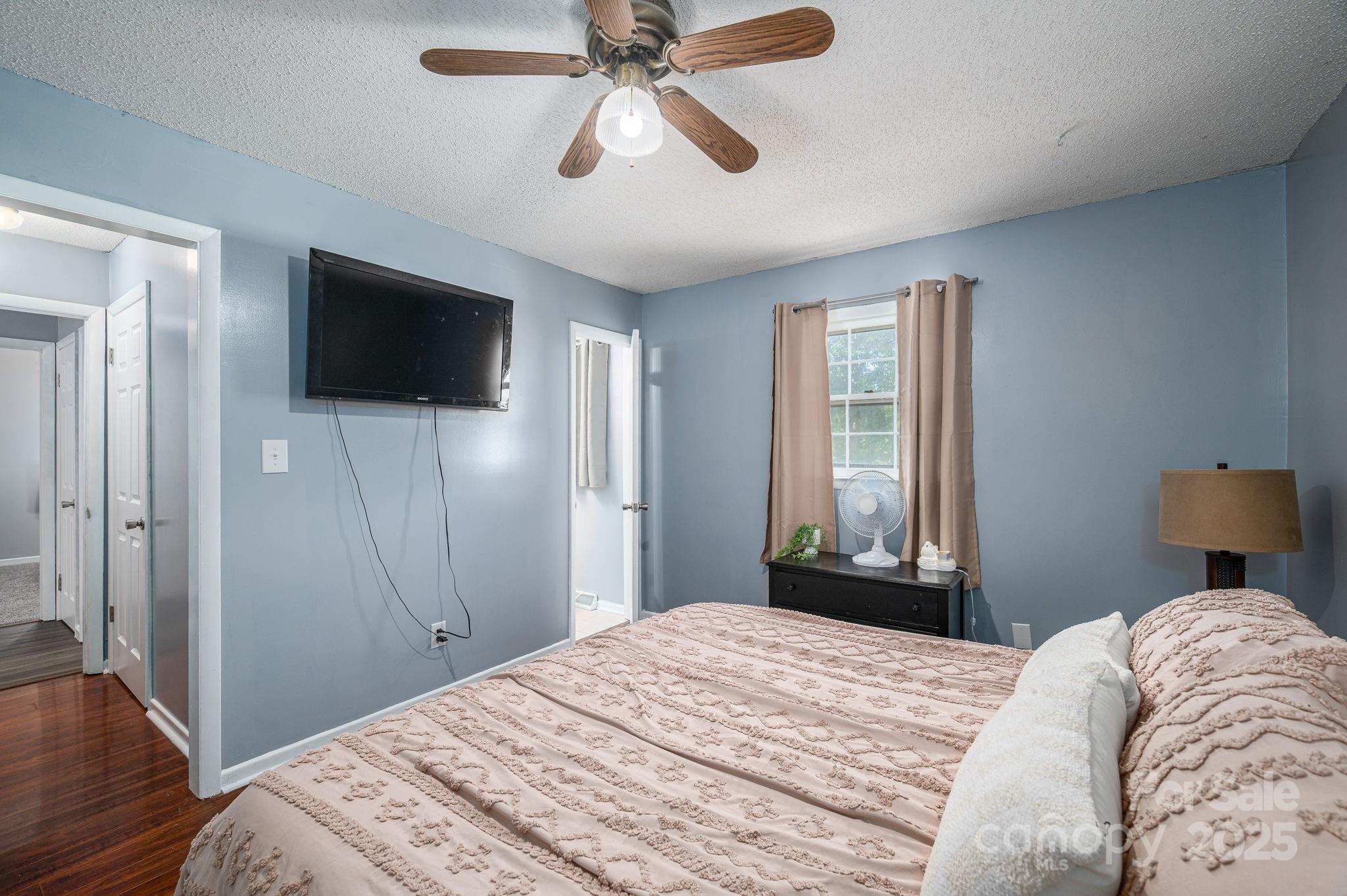 109 White Rock Road Grover, NC 28073 - Photo 13 of 37 a bedroom with a bed and a flat screen tv