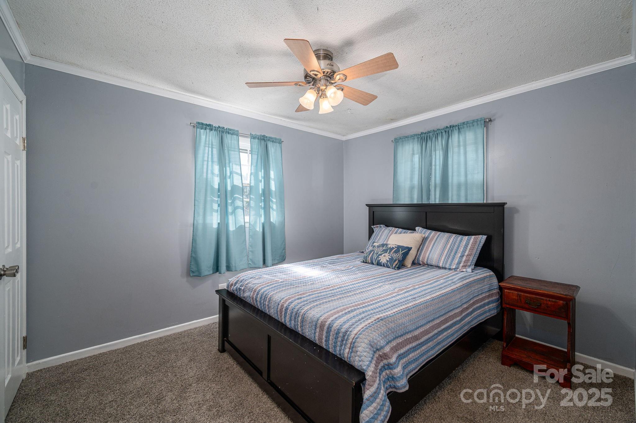 109 White Rock Road Grover, NC 28073 - Photo 15 of 37 a bedroom with a bed and window