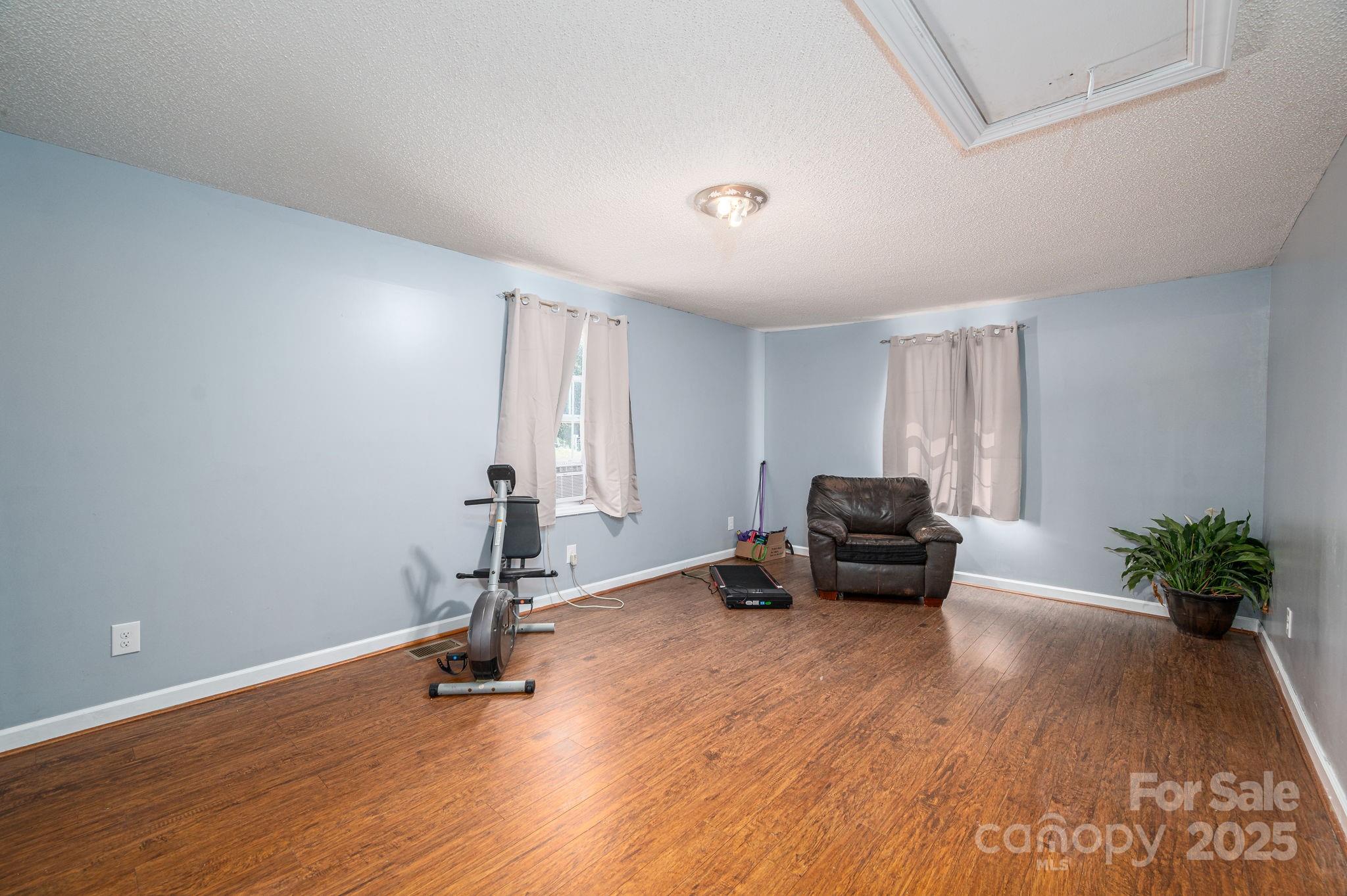 109 White Rock Road Grover, NC 28073 - Photo 20 of 37 a living room with furniture and a potted plant