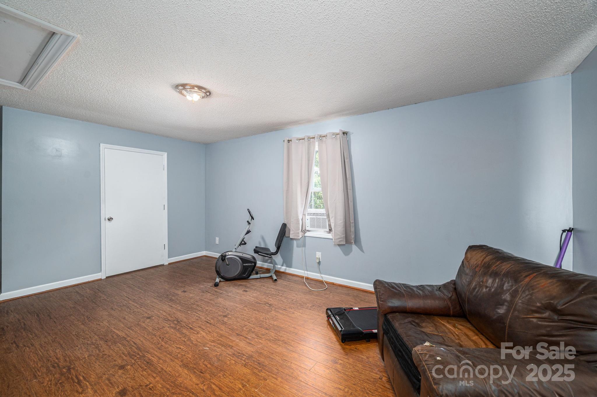 109 White Rock Road Grover, NC 28073 - Photo 21 of 37 a living room with furniture window and a wooden floor