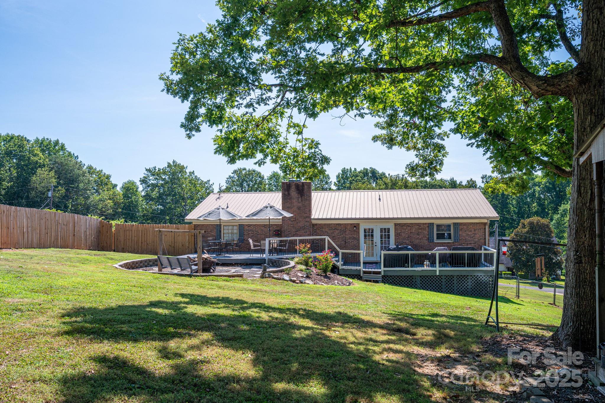 109 White Rock Road Grover, NC 28073 - Photo 26 of 37 a view of a house with pool and a big yard