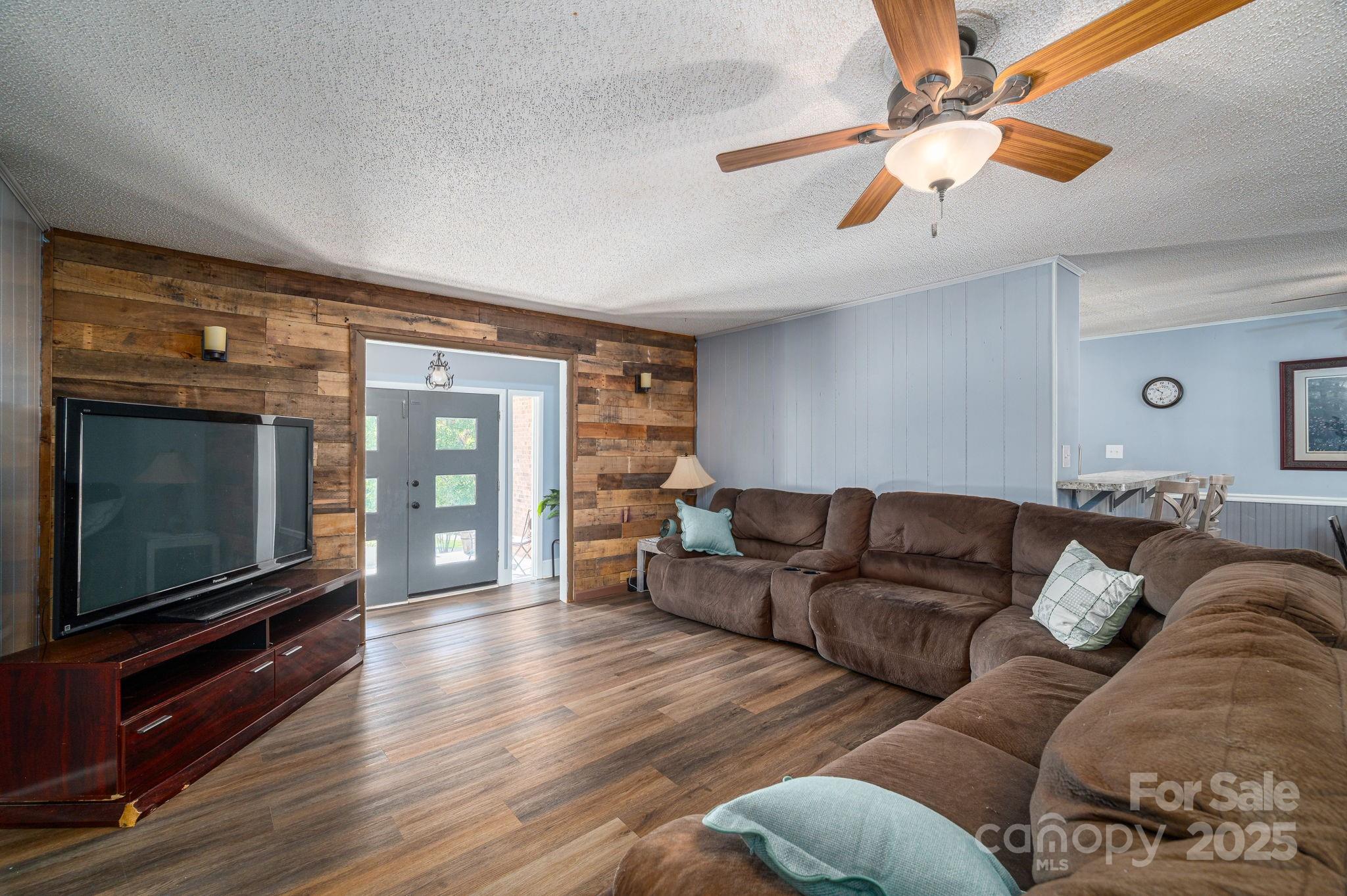 109 White Rock Road Grover, NC 28073 - Photo 3 of 37 a living room with furniture and a flat screen tv
