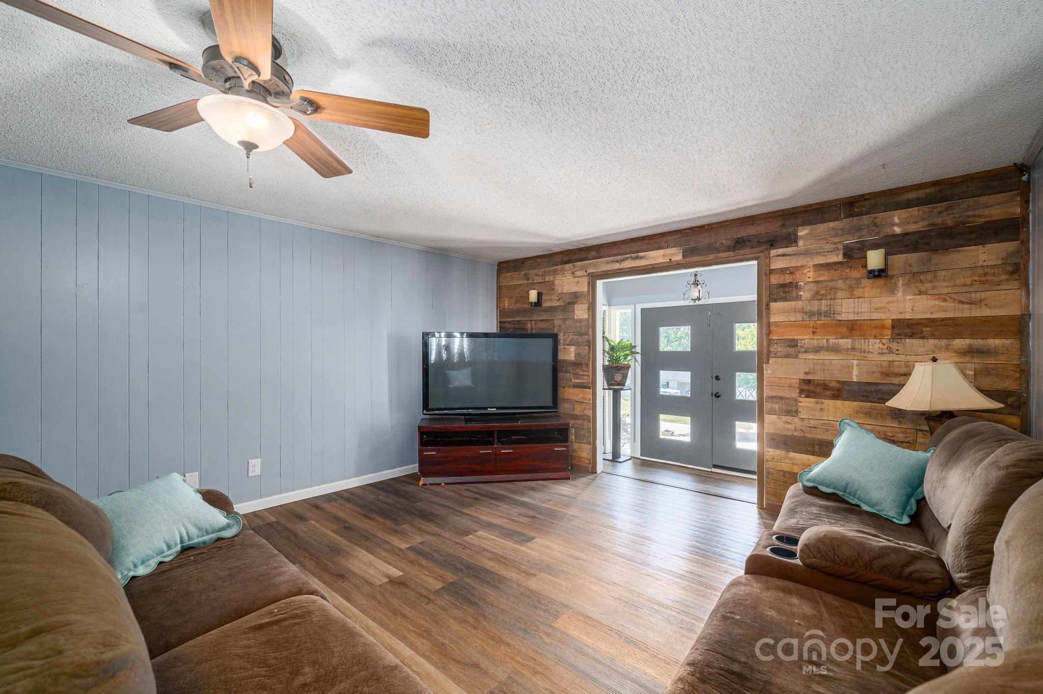 109 White Rock Road Grover, NC 28073 - Photo 4 of 37 a bedroom with furniture and a flat screen tv