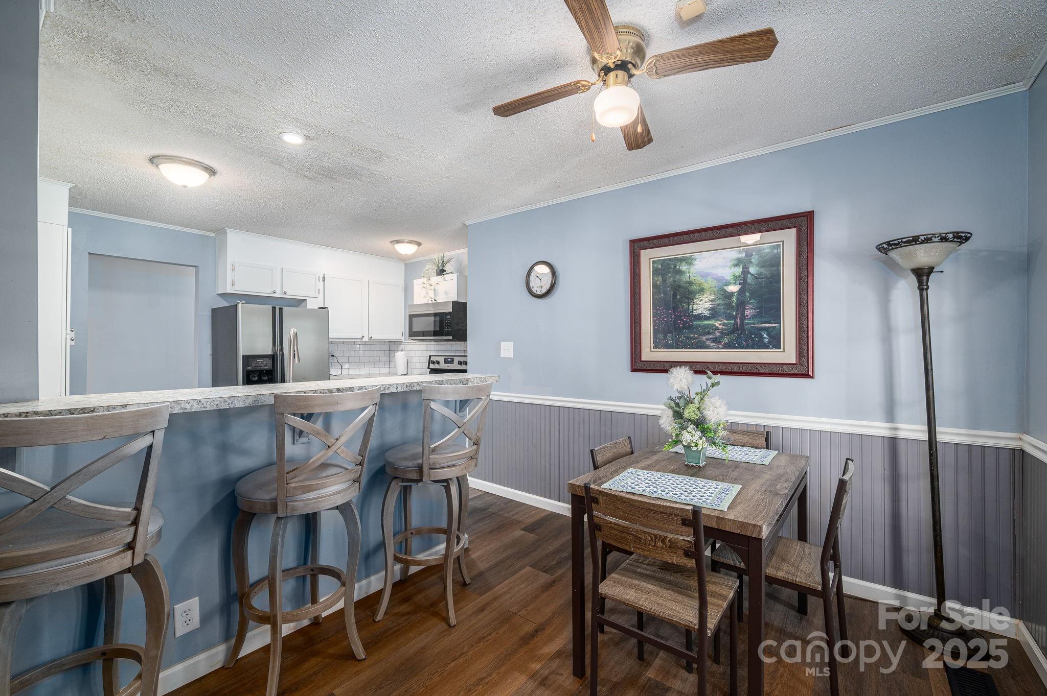 109 White Rock Road Grover, NC 28073 - Photo 5 of 37 a view of a dining room with furniture and a chandelier