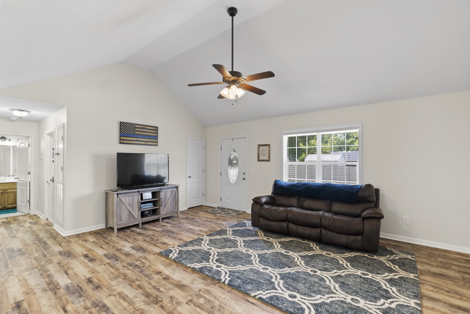 1207 East Ab Wade Road Portland, TN 37148 - Photo 3 of 14 a living room with furniture a ceiling fan and a window