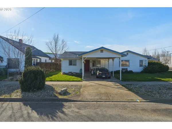 a house view with a garden space