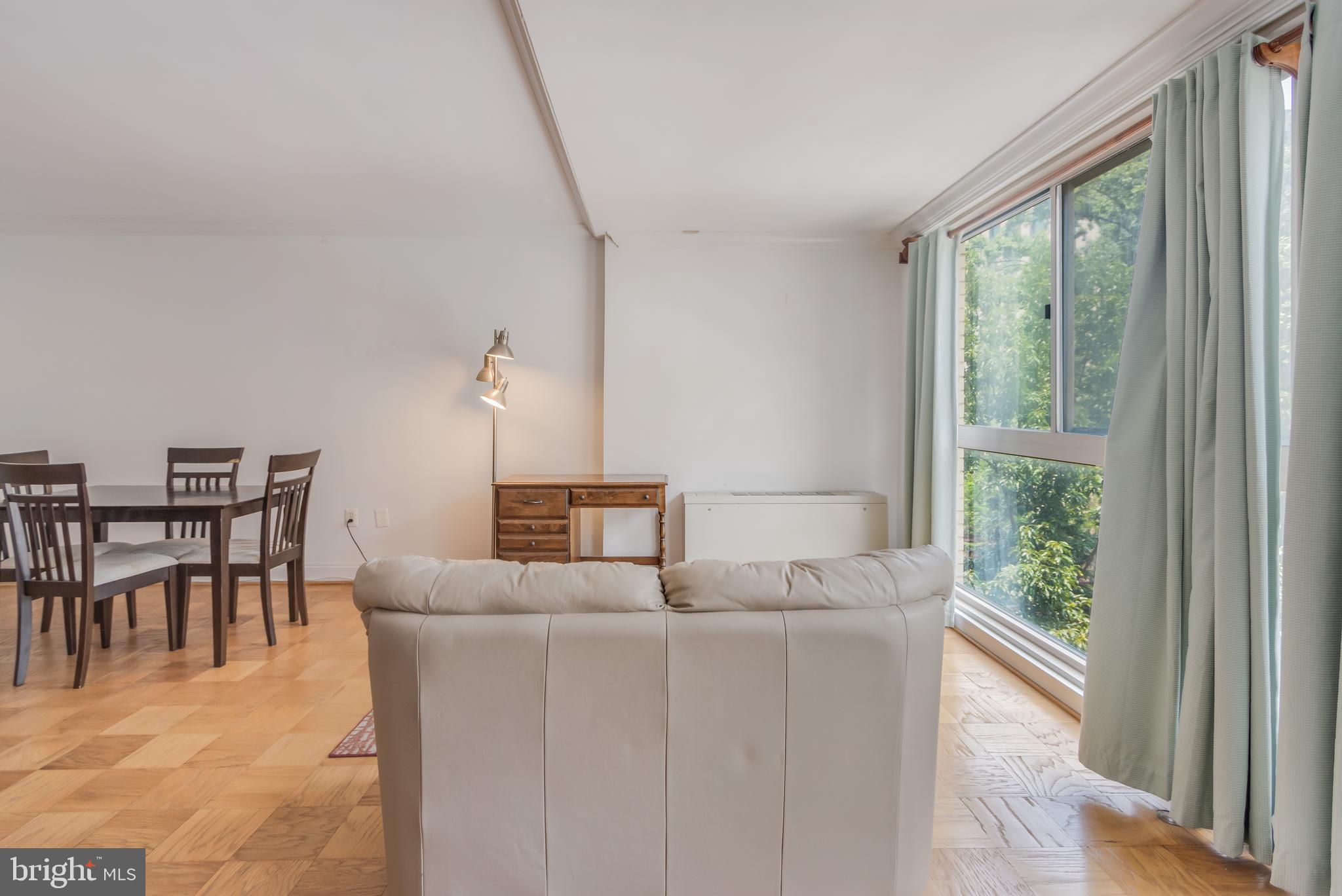922 24th Street Northwest, Unit 415 Washington, DC 20037 - Photo 14 of 25 a dining room with furniture and a window