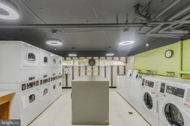 a kitchen with lot of cabinets and refrigerator